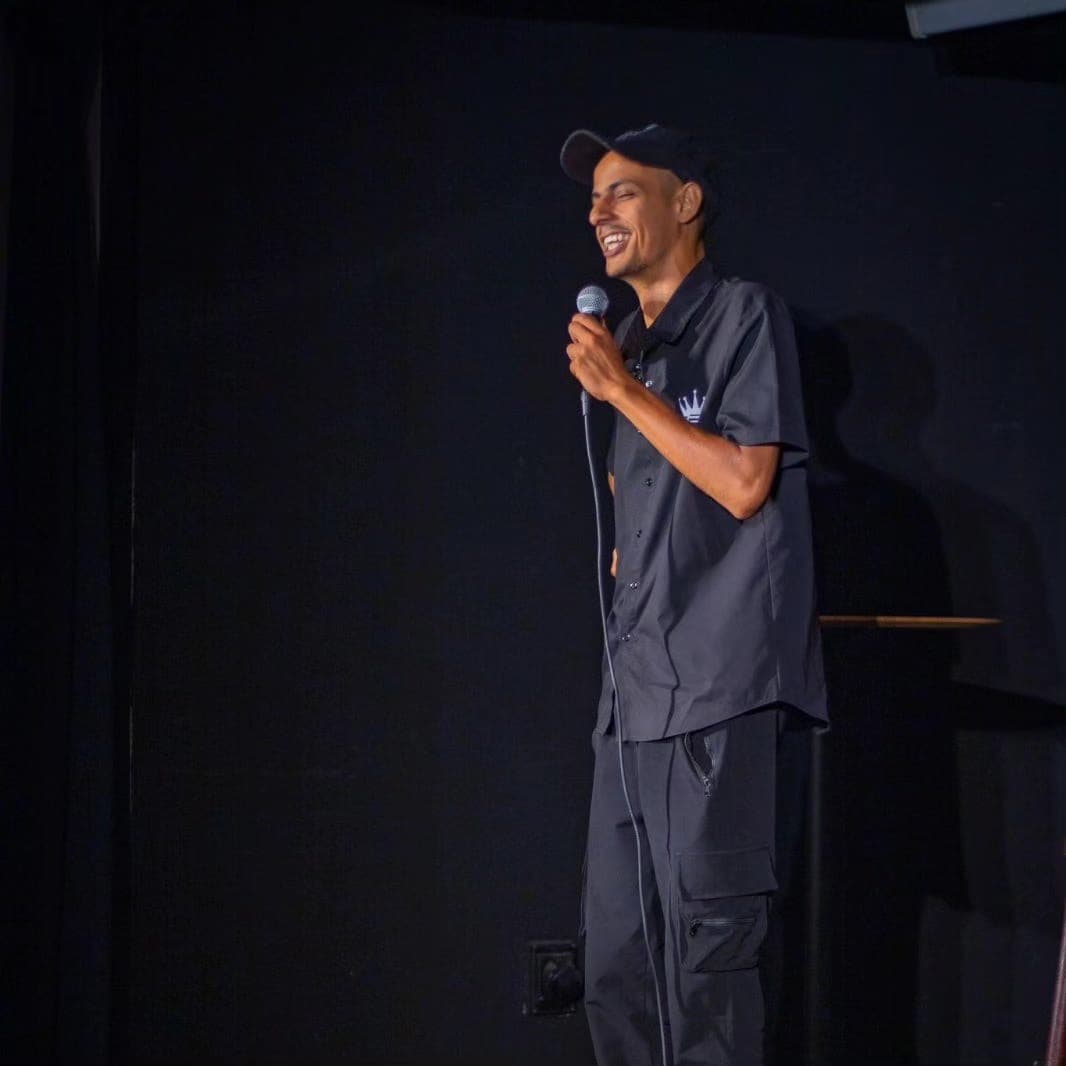 Mohammad Namma delivering inspirational comedy performance, heart surgery survivor turned comedian and performer